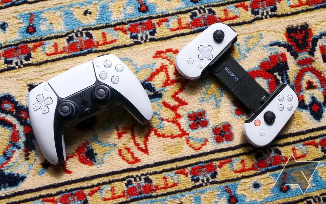 white and black game controllers resting on multicolored carpet