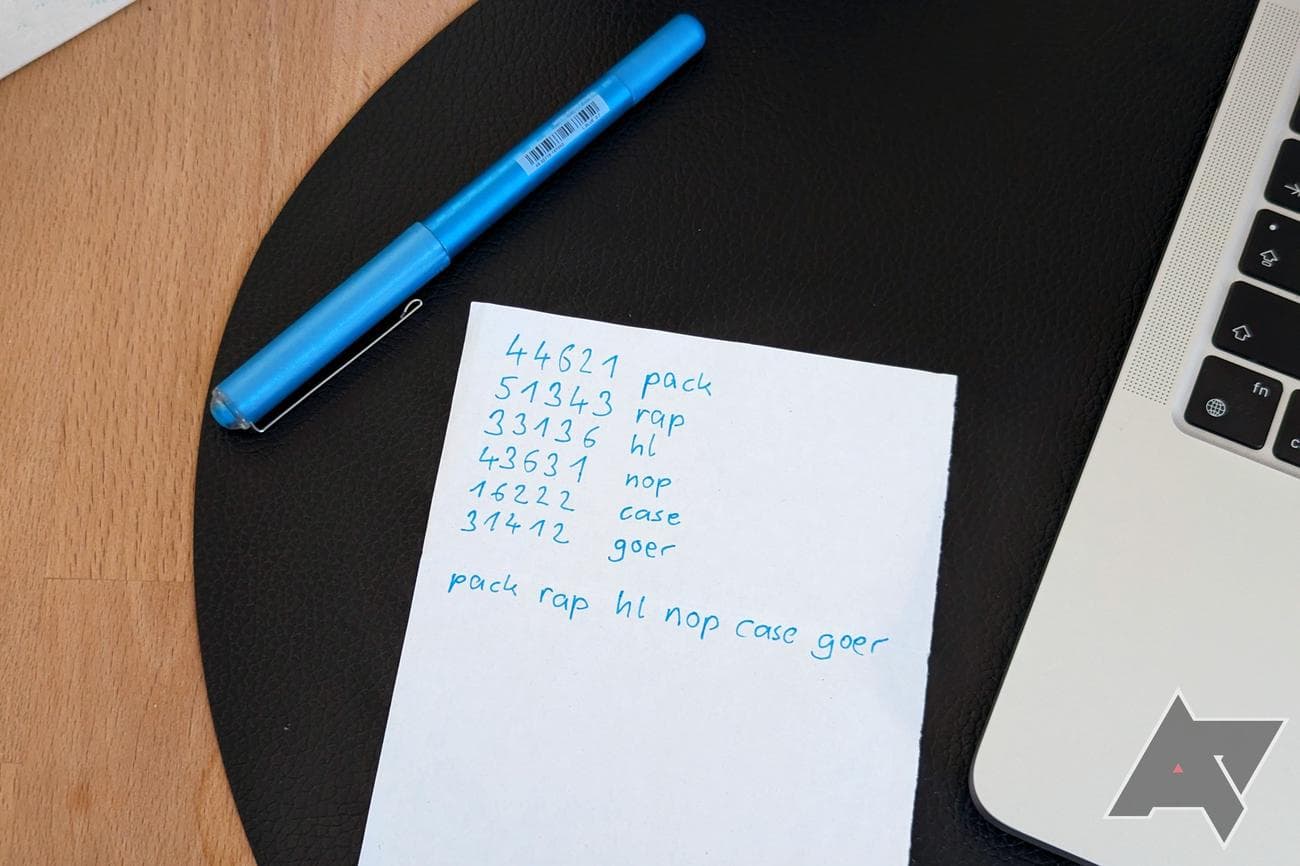 A sheet of paper with numbers in pairs of five noted down and passphrase list results next to them, with the finished passphrase below it