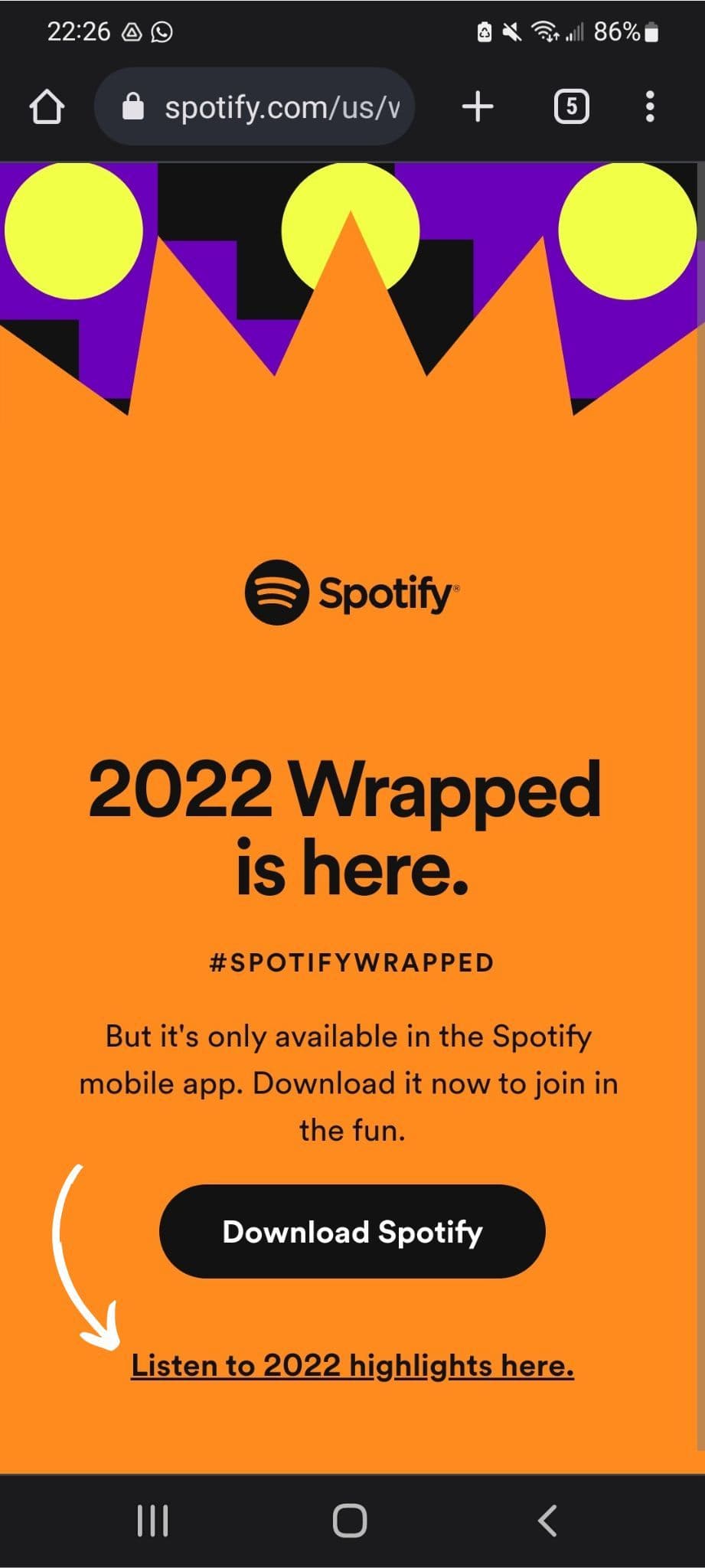 Screenshot of the Spotify website opened on an Android browser. The orange page with black text reads ‘2022 Wrapped is here’. There is a button to download Spotify and a link to ‘Listen to 2022 highlights here’.