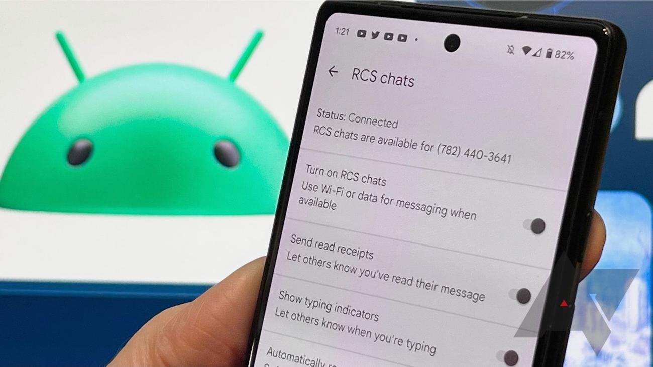 RCS chats settings is onscreen as Pixel 6a is being held in front of the Android mascot