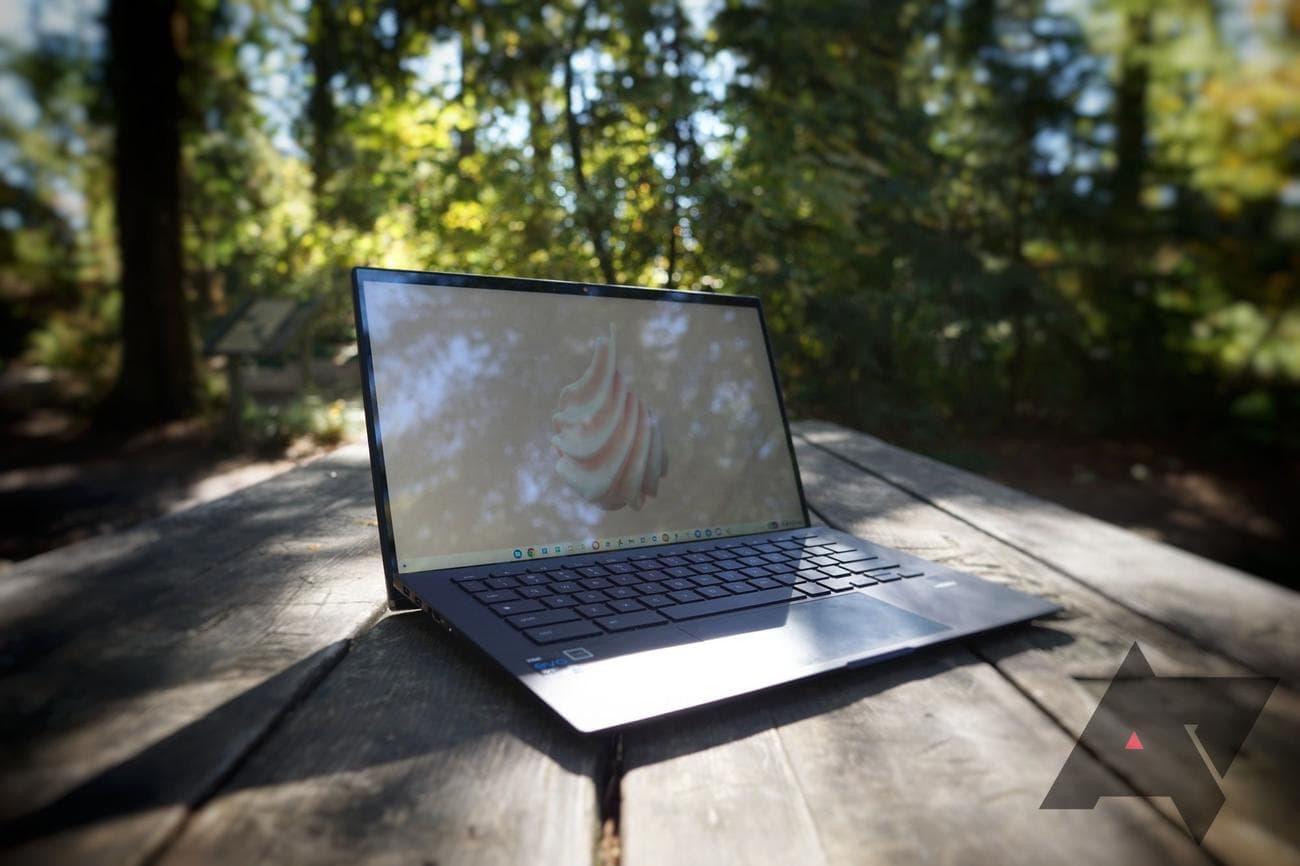 An Asus Chromebook CX9 in a picnic table in the woods