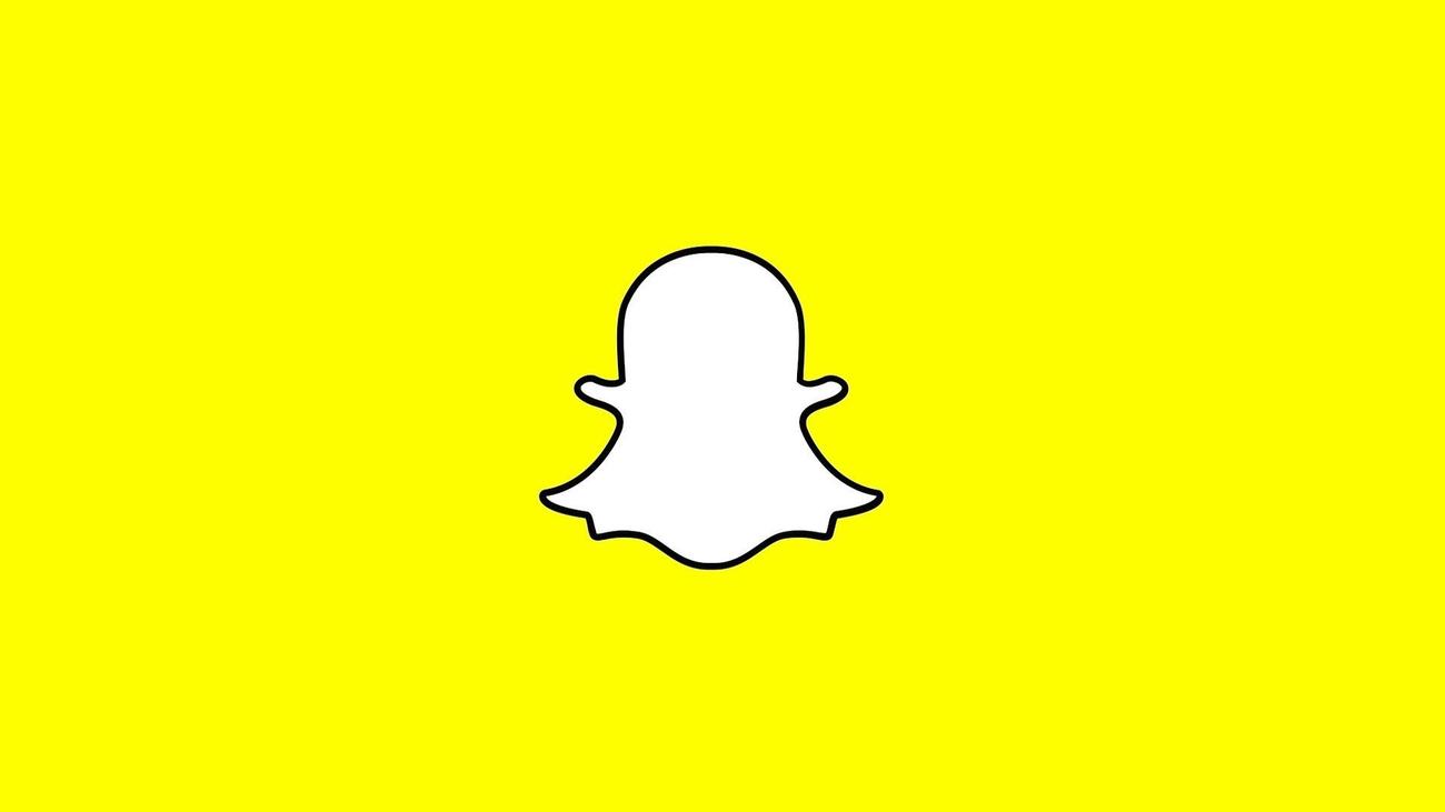 The Snapchat ghost mascot against a yellow background. 