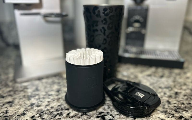 BruMate pour-over travel tumbler in Black Onyx Leopard print on a counter with Nespresso and XBloom machines