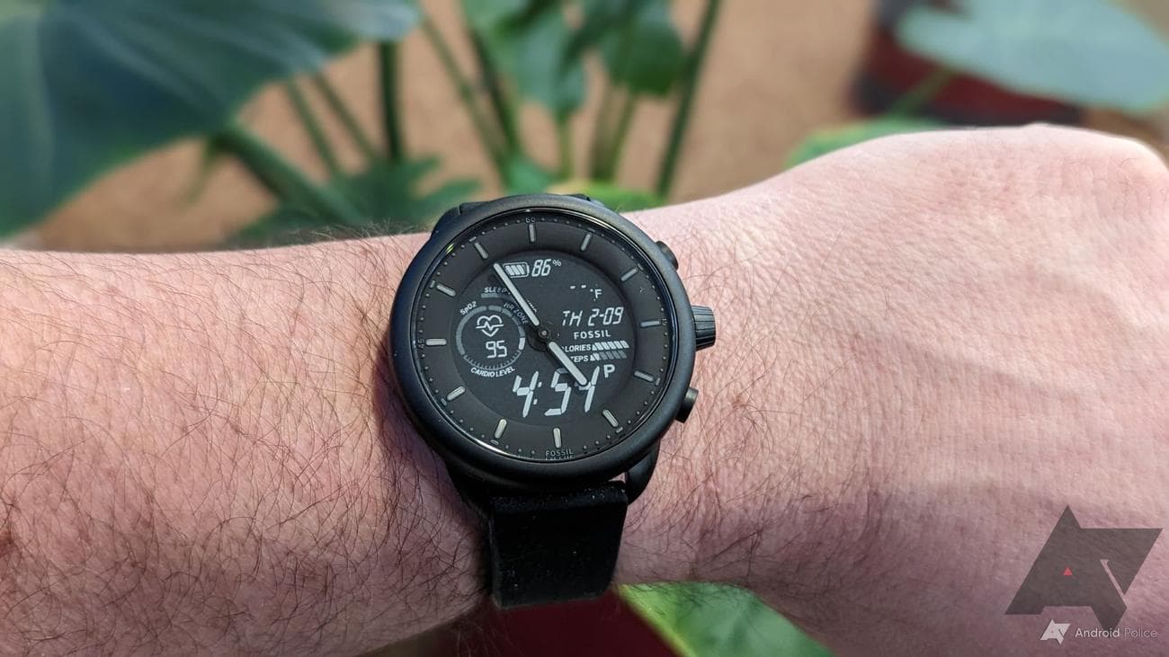 A black Fossil Gen 6 Hybrid Wellness Edition being worn on a wrist