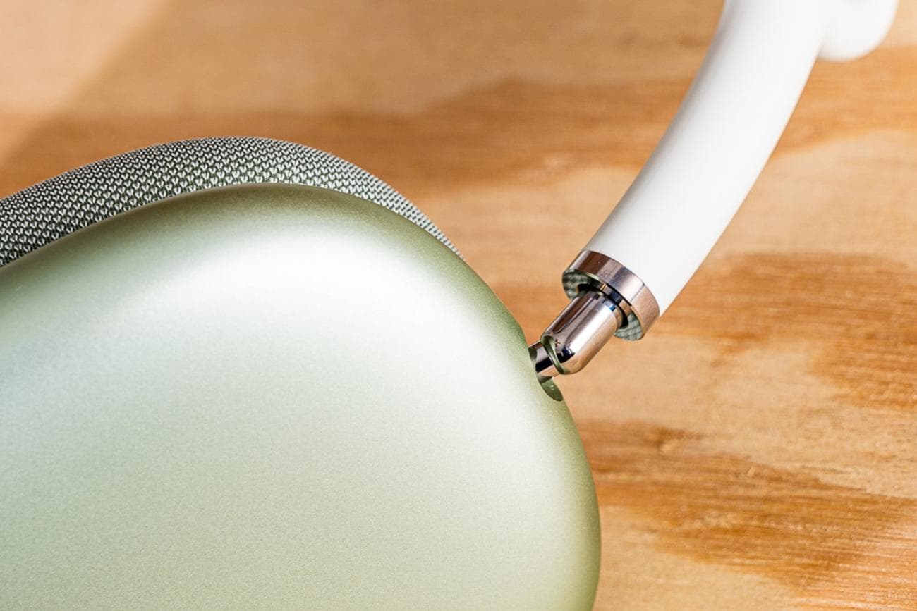 The connection between the headband and the ear cup on the Apple AirPods Max headphones. 
