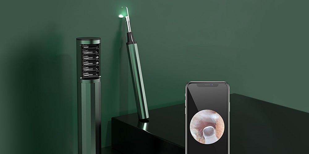 A ear cleaner on a green background