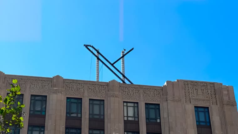 The X logo being dismantled