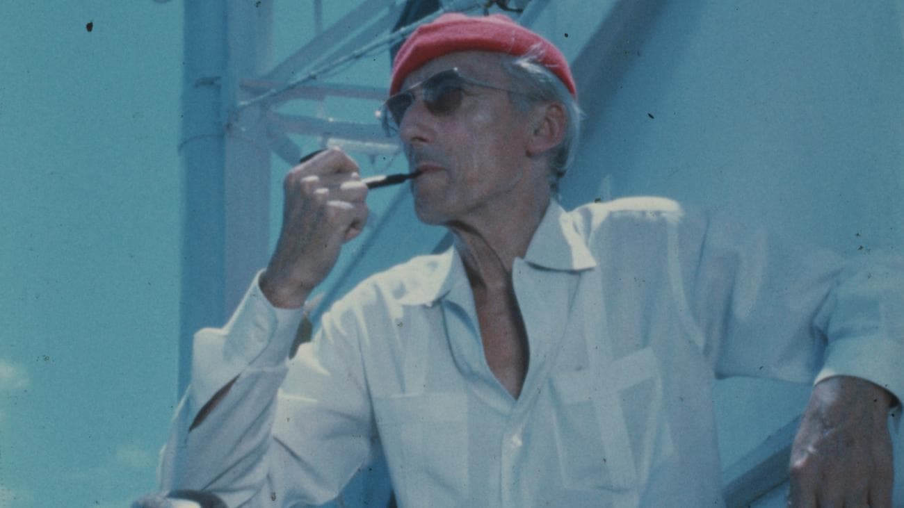 Jacques Cousteau wears his iconic red diving cap aboard his ship Calypso, circa 1970s.
