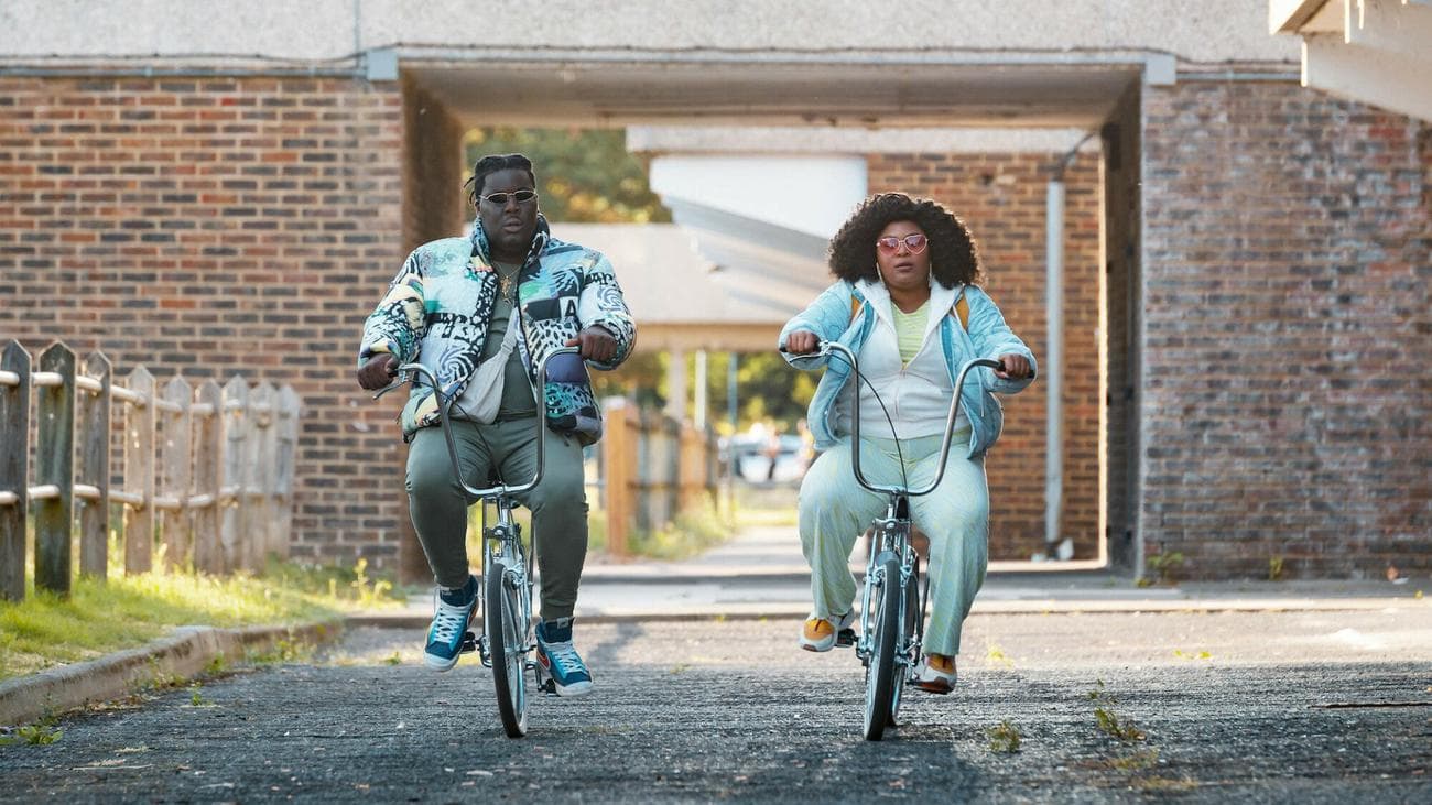Hammed Animashaun and Gbemisola Ikumelo ride bikes in the show "Black Ops"