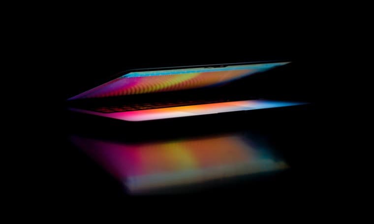 Apple MacBook with black background