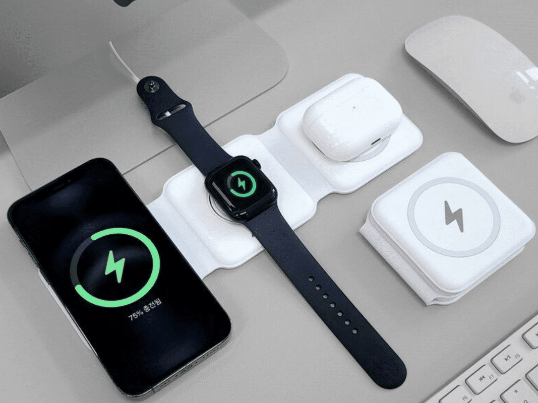 Multiple electronics sitting on a wireless charges