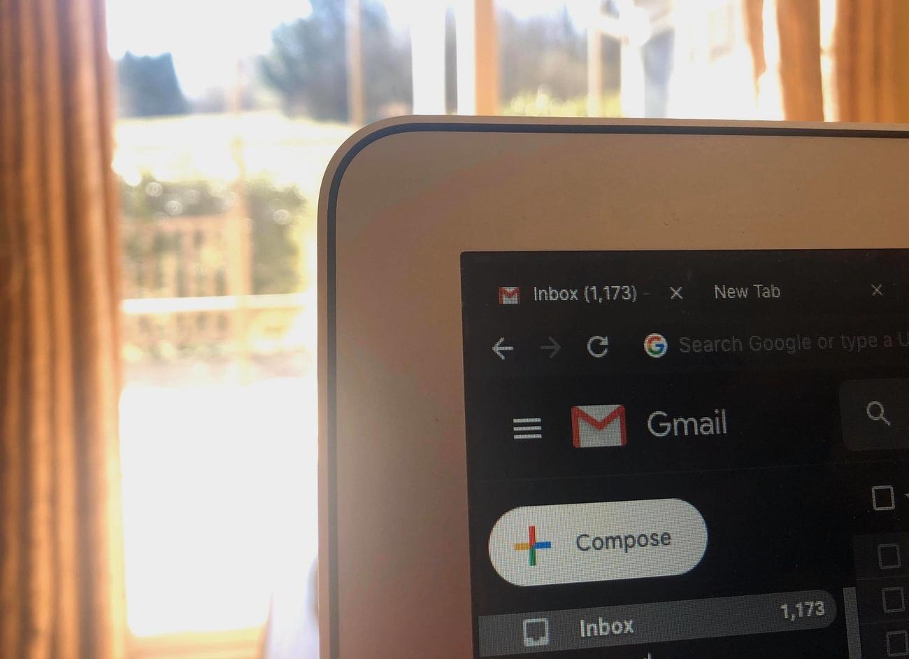 a photo of a laptop with a Gmail inbox open
