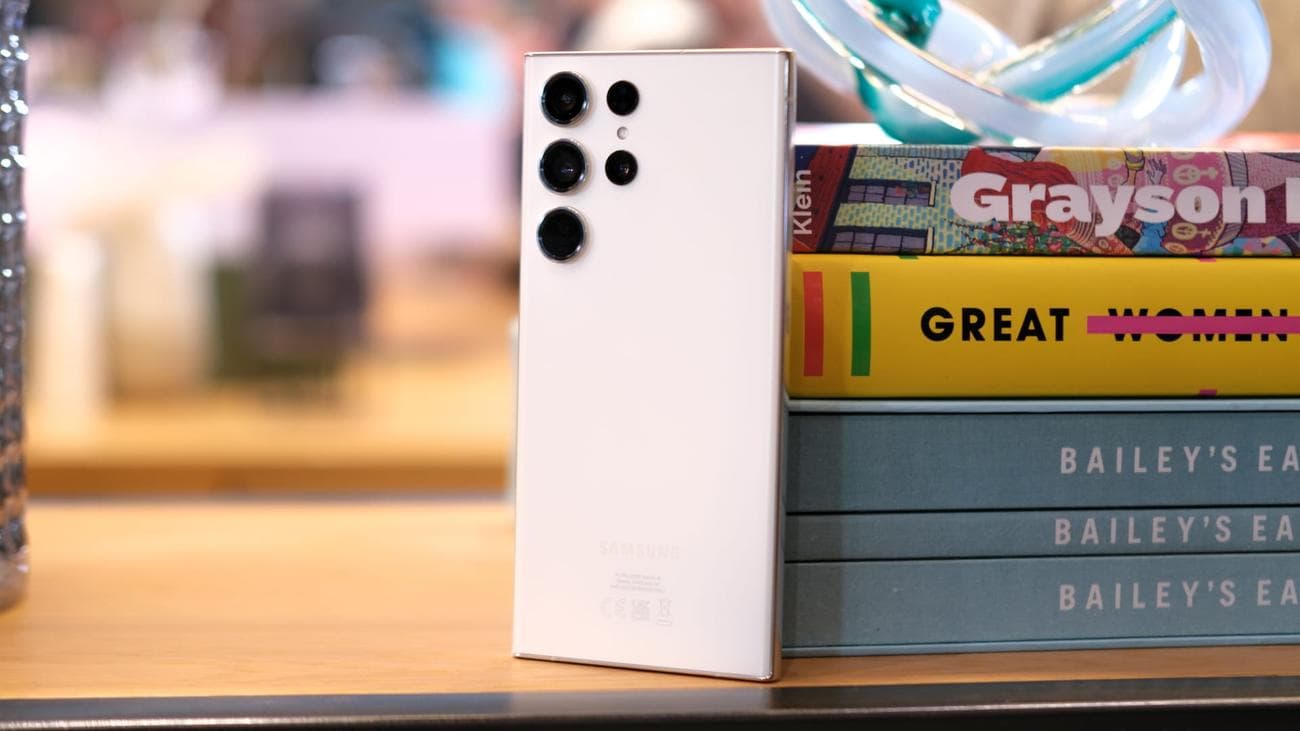 Samsung Galaxy S23 Ultra Cream back standing by books