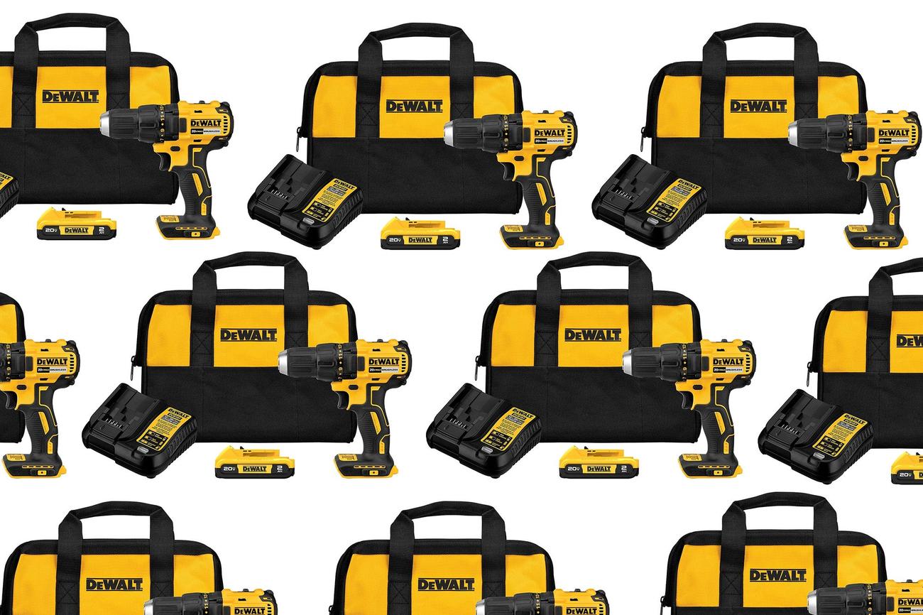A DeWalt impact driver kit on a plain background