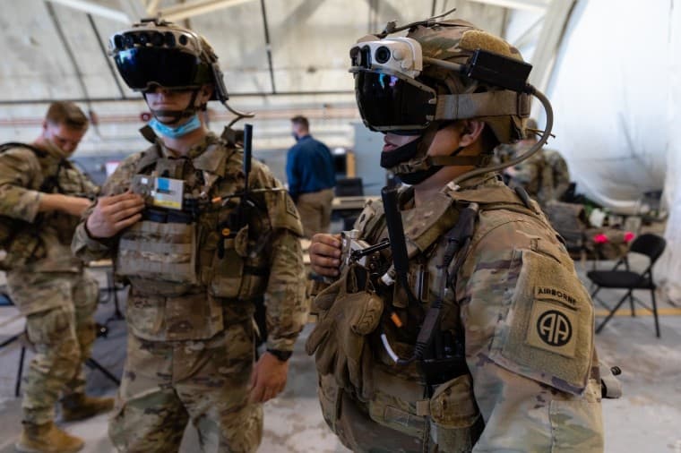 Two US Army soldiers wearing HoloLens headsets
