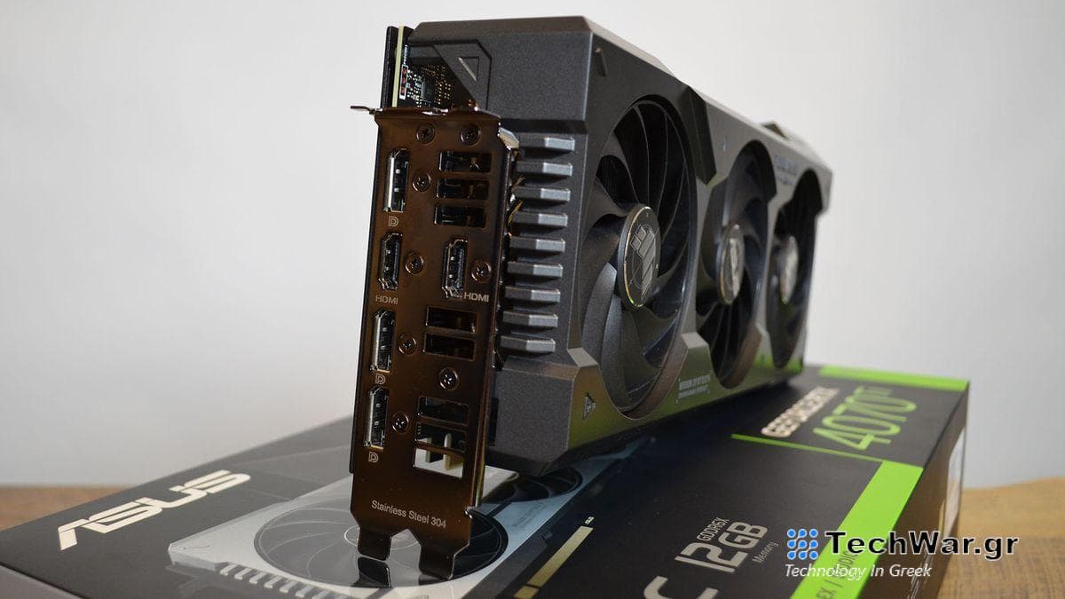 An Nvidia GeForce RTX 4070 Ti graphics card on a wooden table with its retail packaging