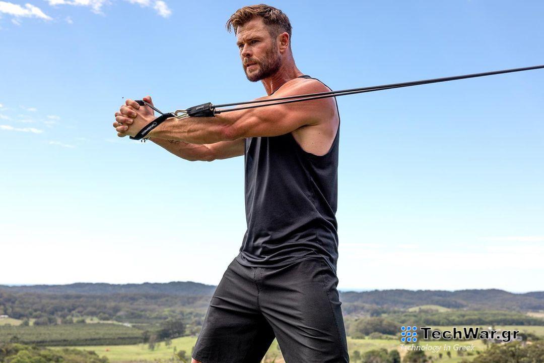 a photo of Chris Hemsworth doing a resistance band workout