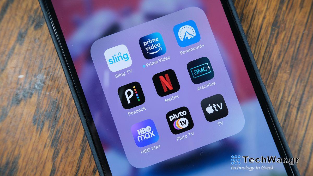 A grid of streaming service apps (Sling, Prime Video, Paramount Plus, Peacock, Netflix, AMC Plus, HBO Max, Pluto TV, Apple TV) open on a phone
