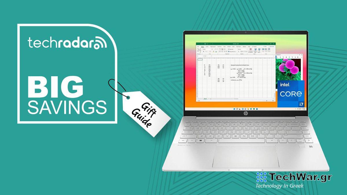 silver laptop against blue background