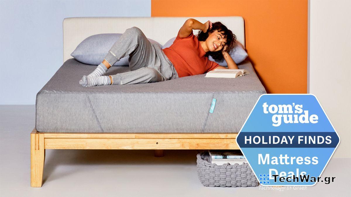 Siena Memory Foam Mattress sale image shows a woman with curly brown hair wearing a red t-shirt and grey sweat pants lying on her side reading a book on top of the Siena Mattress