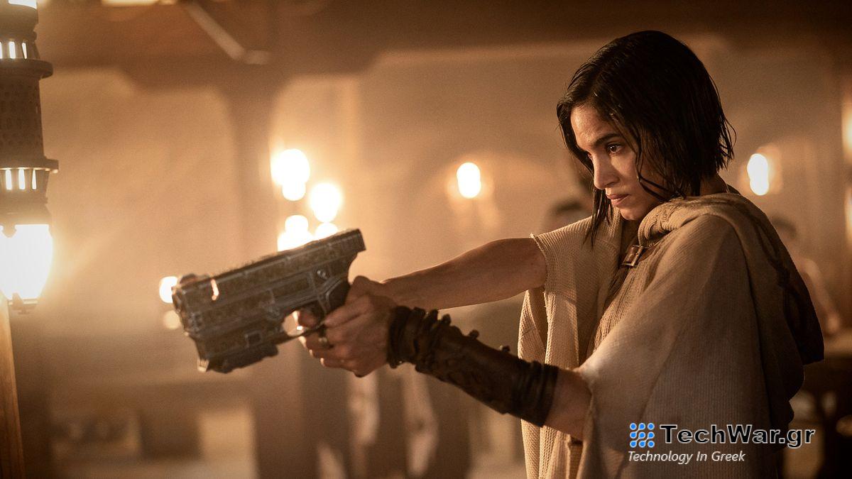 Kora points a pistol at someone off-camera in Netflix