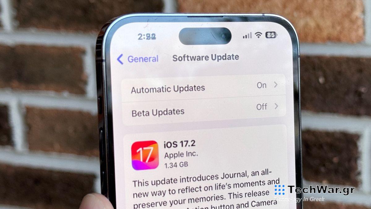 iPhone shown with notification to download iOS 17.2.