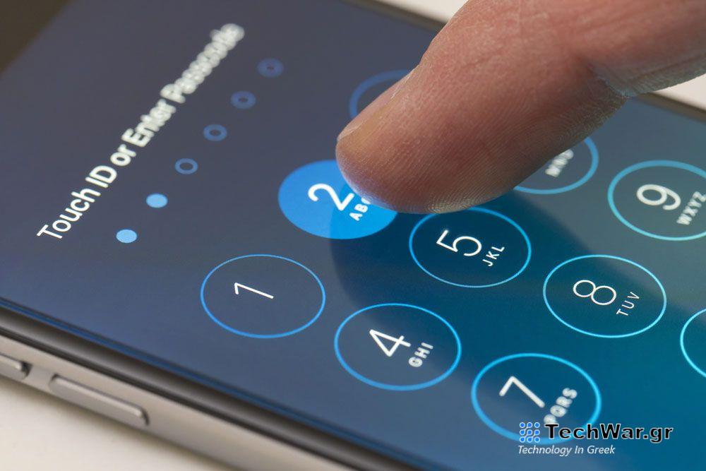 Finger typing passcode into iPhone screen.