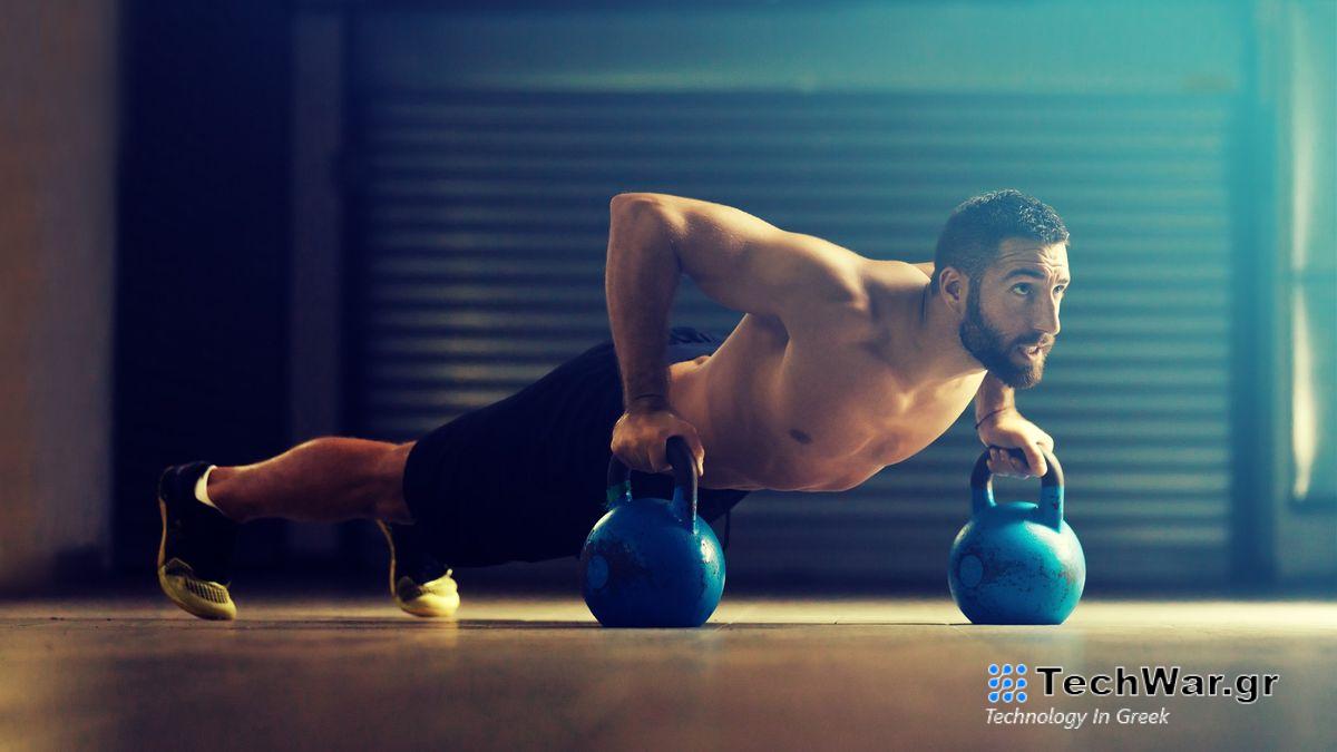 Man performing kettlebell push-ups during workout 