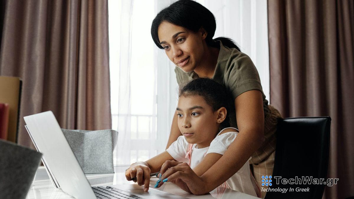 Parent and child on a laptop