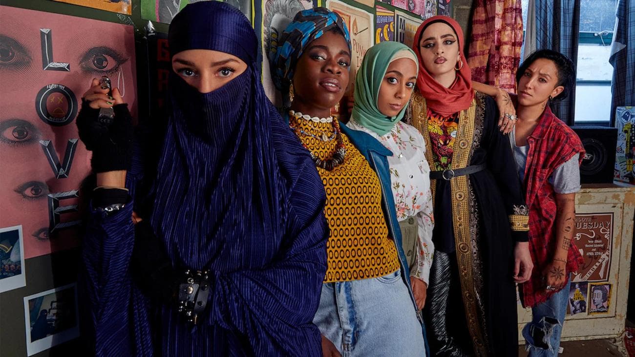 A group of young Muslim women pose for the camera.