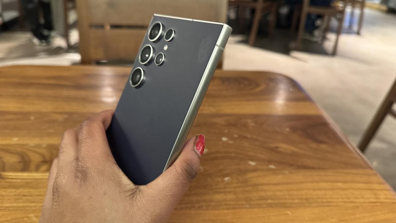 Woman grasping Galaxy S24 Ultra