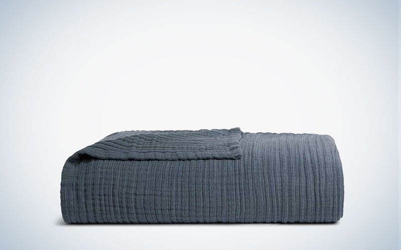 A navy Cloud Linen Gauze Bed Blanket on a plain background.