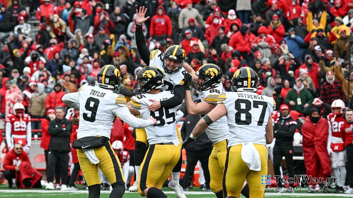 Place kicker Marshall Meeder #92 of the Iowa Hawkeyes is carried by punter Tory Taylor #9 and defensive lineman Logan Lee #85 and tight end Steven Stilianos ahead of the Iowa vs Tennessee Citrus Bowl 2023