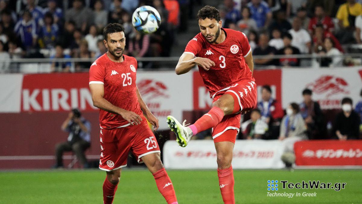Omar Montassar (R) clears the ball ahead of the Tunisia vs Namibia live stream
