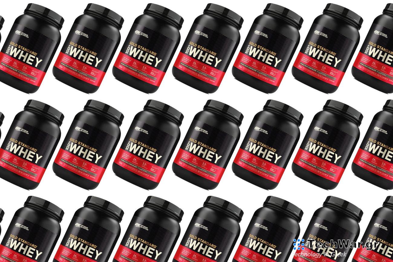 A container of Optimum Nutrition Gold Standard protein powder on a plain background.