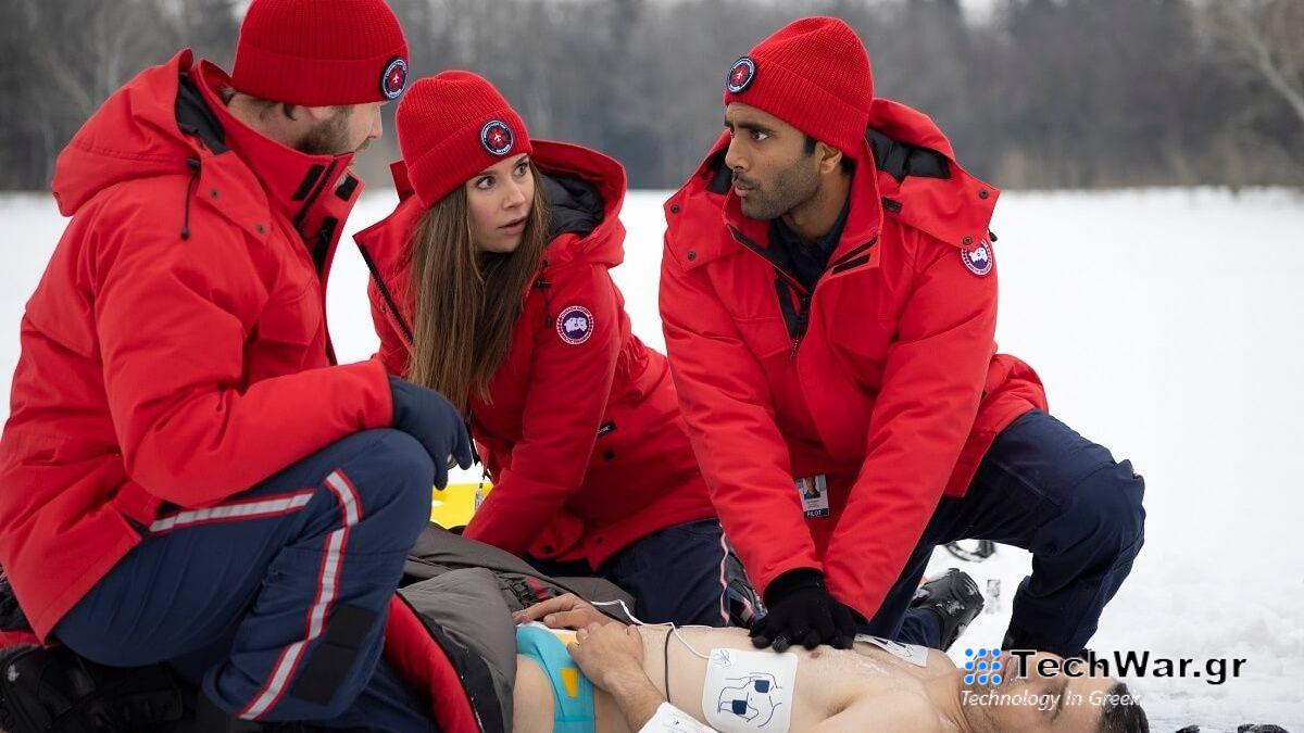 The cast of SkyMed season 2 attend to a patient in on a snowy mountain top