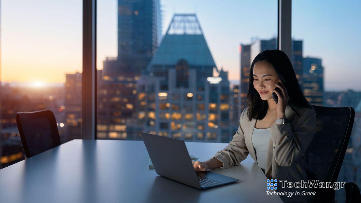 asian woman using laptop at business table