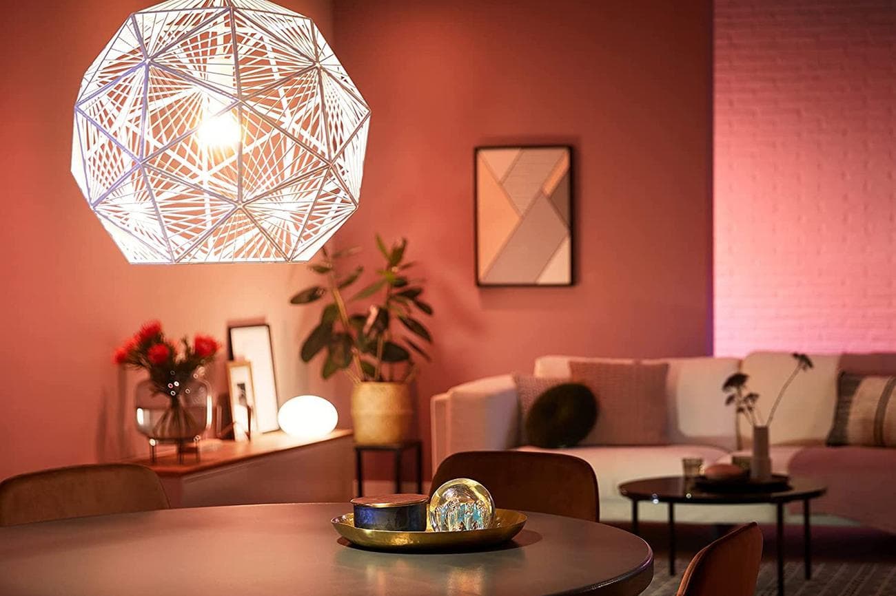 Philips Hue's A19 smart bulb lighting up a living room.