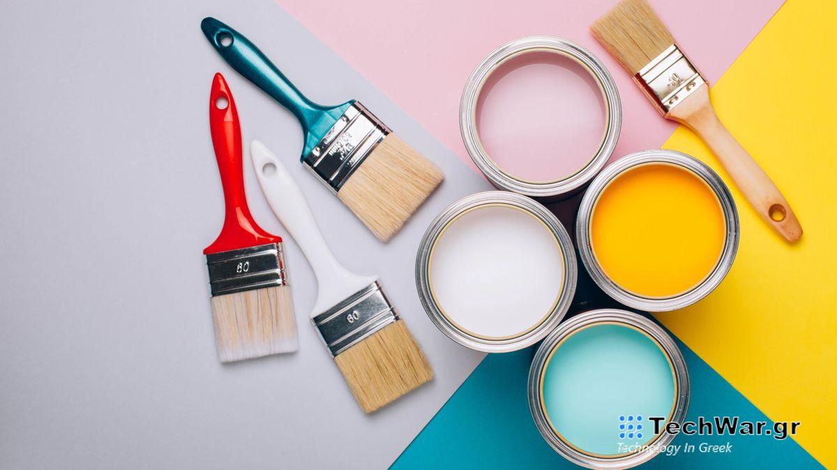 A selection of tins of paint with paintbrushes surrounding them