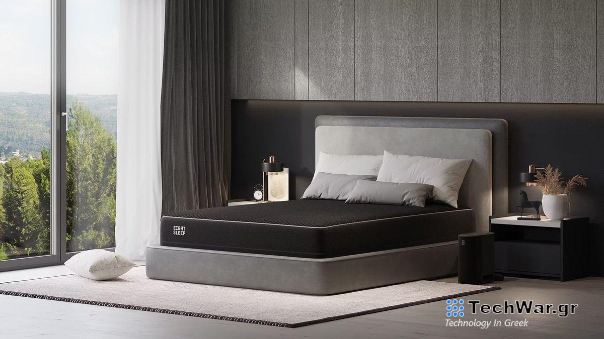 Eight Sleep Pod Pro smart mattress cover system shown on a grey bedframe in a stylish bedroom overlooking hills