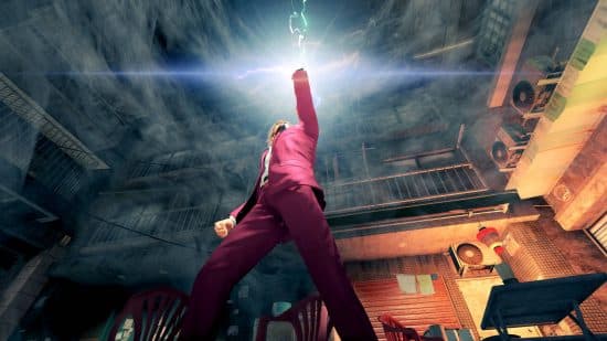 Best JRPGs on PC: Ichiban, the hero of Yakuza: Like a Dragon, is holding his phone aloft as it emits light.