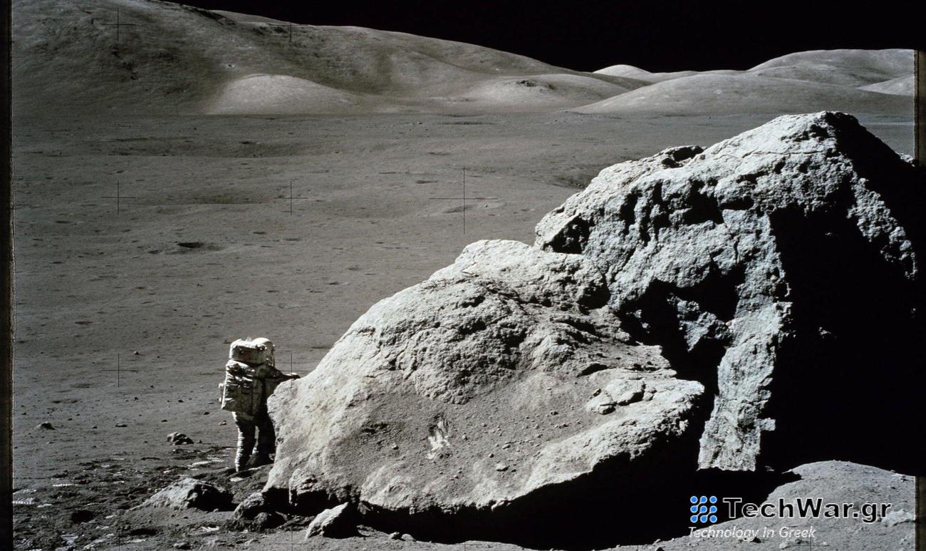 large boulder with astronaut