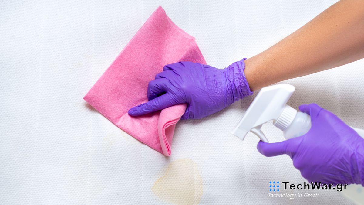 Woman cleaning a mattress topper