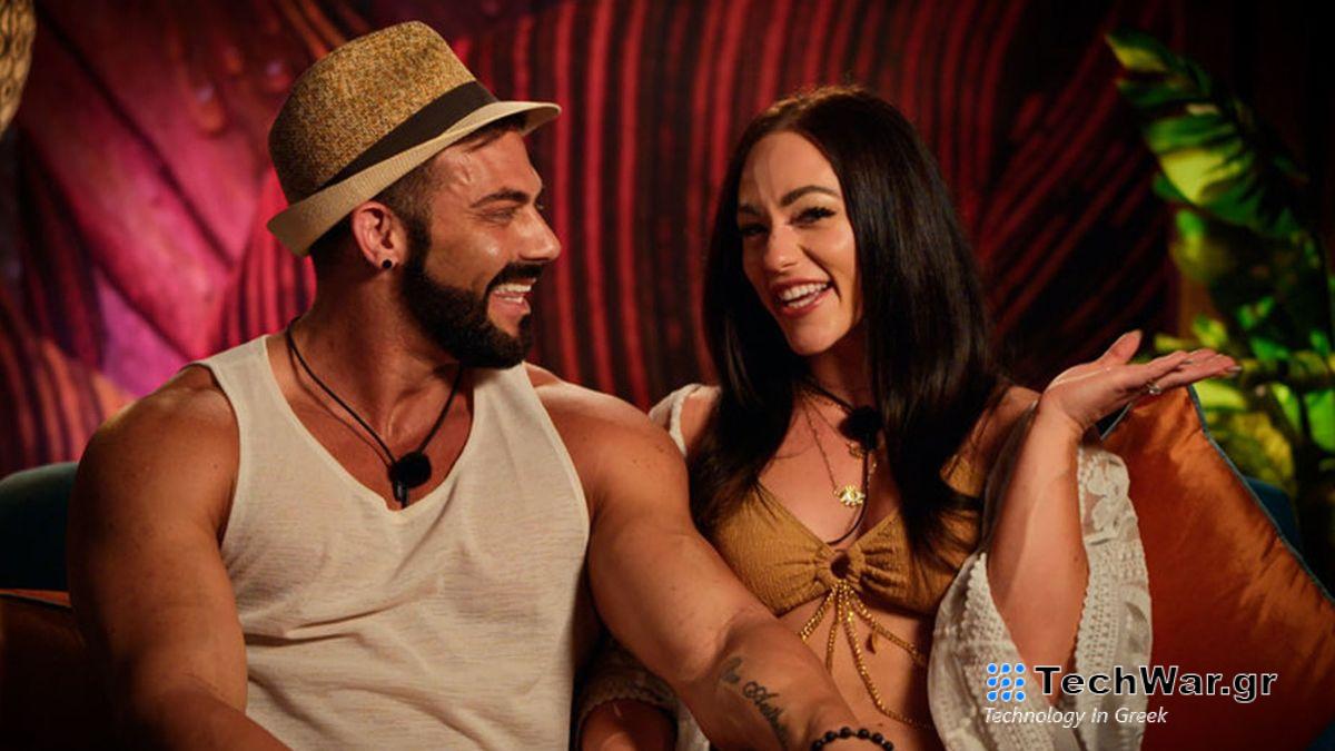 Dylan and Lauren, two of the glamorous stars of Peacock polyamorous dating show Couple to Throuple, giggle on a couch.