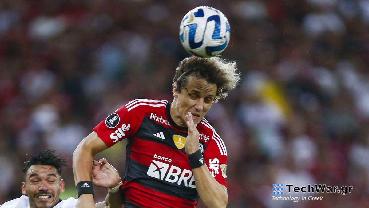 David Luiz of Flamengo heads the ball over Walter Gonzalez of Olimpia ahead of the 2024 Copa Libertadores