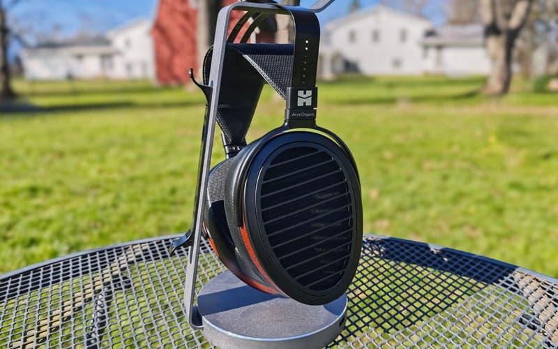 HiFiMAN-Arya-Organic headphones outside on a stand.