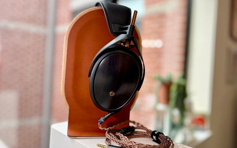 Meze Liric II headphones on a stand.