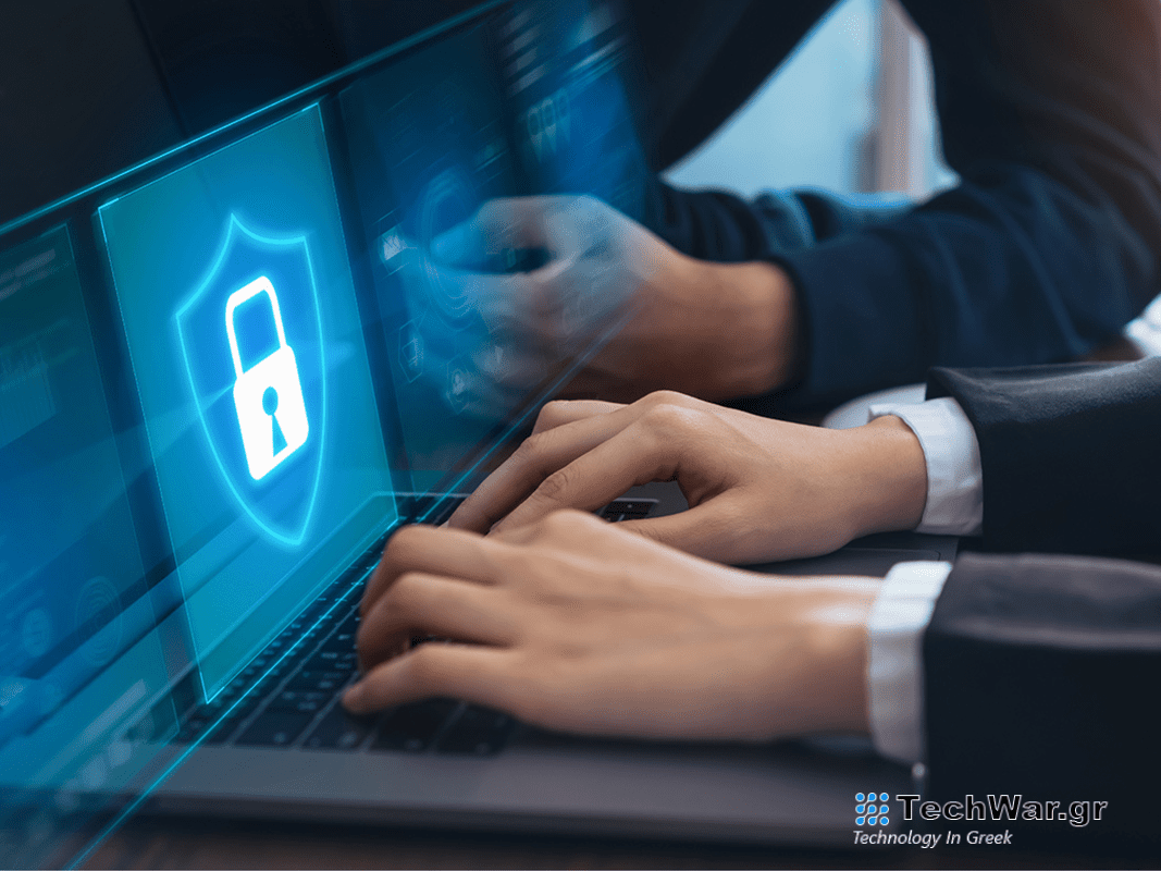 A person typing on a laptop.