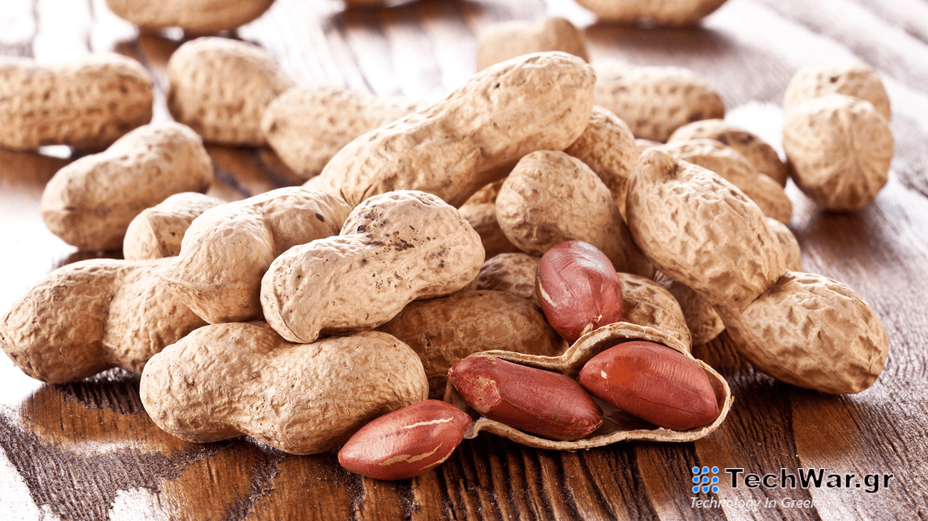 shelled and unshelled peanuts on a table