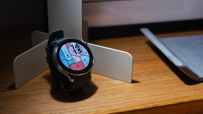 OnePlus Watch 2 showing watch face on shelf